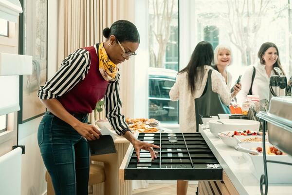 Regina Correa looking through samples